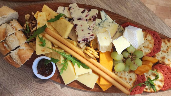 A grand selection of cheeses, crackers, chutney and fruits. The Cheesy One