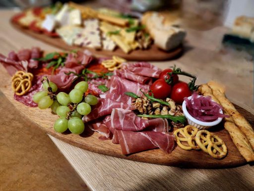 A variety of meats, bread, pâté, fruits and chutney. The Meaty One