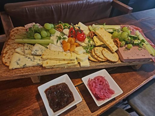 Grazing Board - A delicious spread consisting of a variety of cheeses, meats, crackers, pâté, bread, fruits, chutney and other nibbly bits! Grazing Board